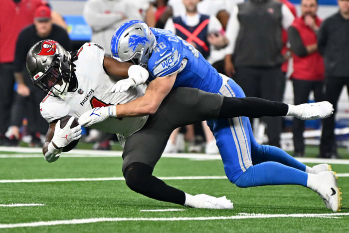 Detroit Lions linebacker Jack Campbell (46) tackles Tampa Bay Buccaneers running back Rachaad White (1) during the first quarter in a 2024 NFC divisional round game at Ford Field. Mandatory Credit: Lon Horwedel-USA TODAY Sports
